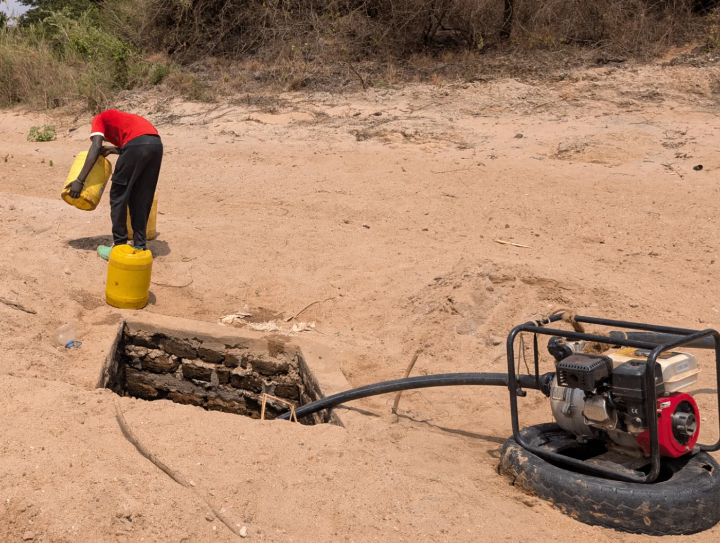 Today's reality: diesel pumps drawing the last water from a sand-dam well.